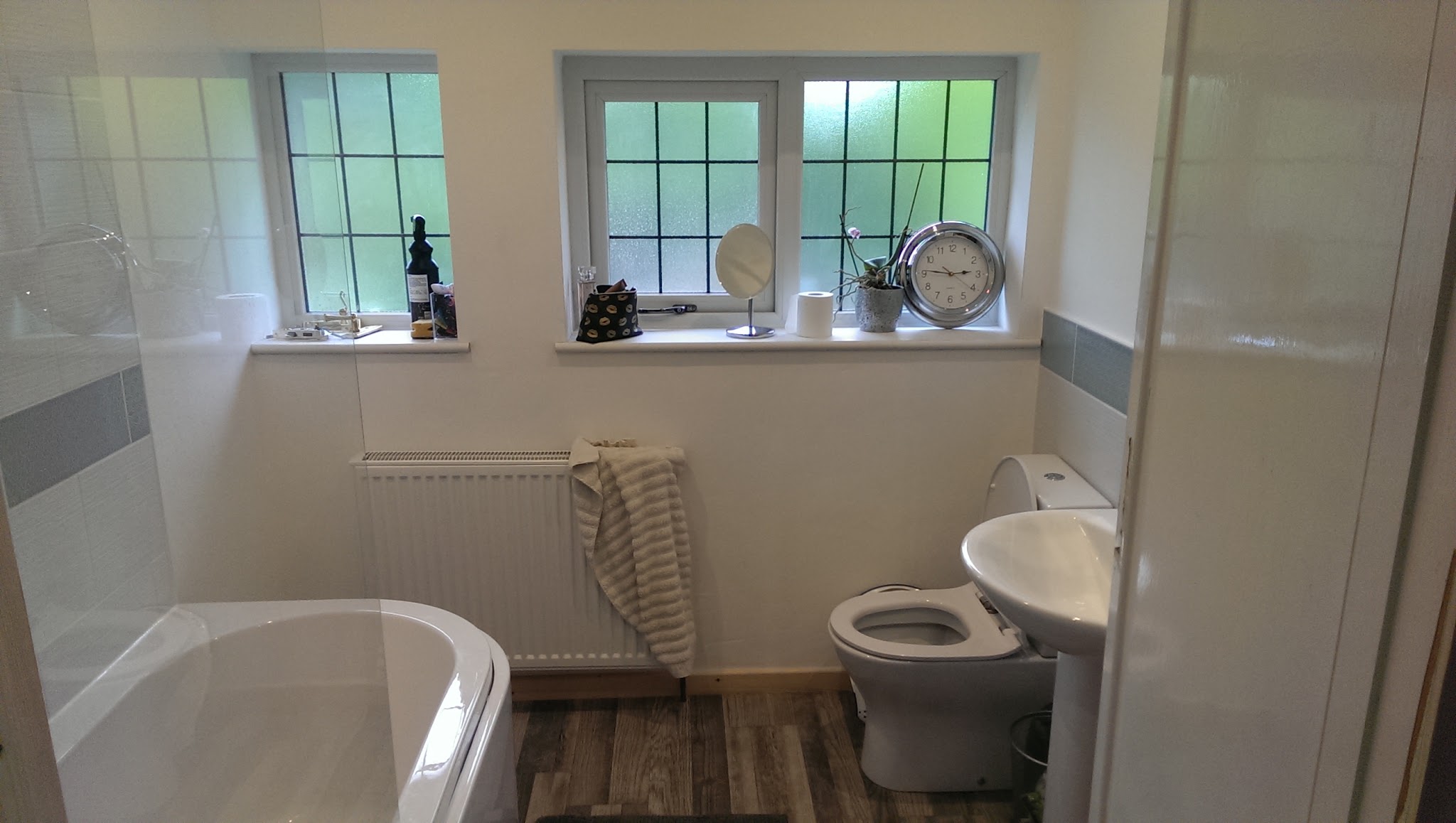 Family bathroom refit with bath, radiator and new tiling
